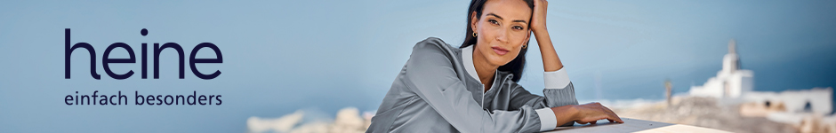 heine Logo auf einem Bild mit Frau mit dunklen Haaren. Im Hintergrund sieht man blauben Himmel und ein kleines Dorf.